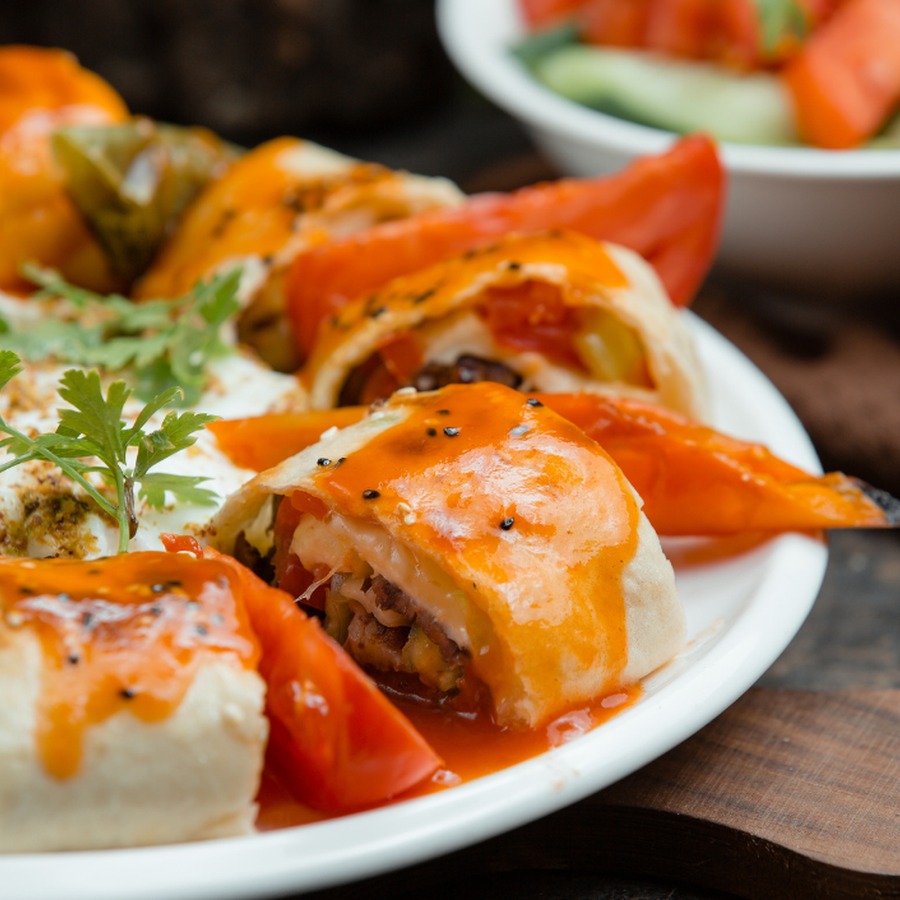 Sarma Beyti — wrapped charcoal kebab rounds with tomato and yoghurt